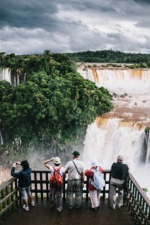 Rear View of Group of Tourists Viewing Waterfalls, Foz do Iguacu, Brazil
