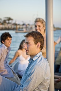 Two Young Couples Relaxing on Sailboat