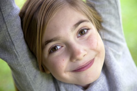Smiling Girl With Arms Up