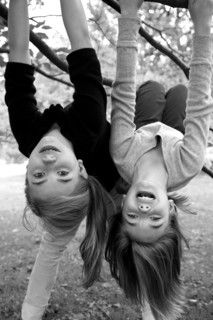 Two Girls Hanging Upside Down