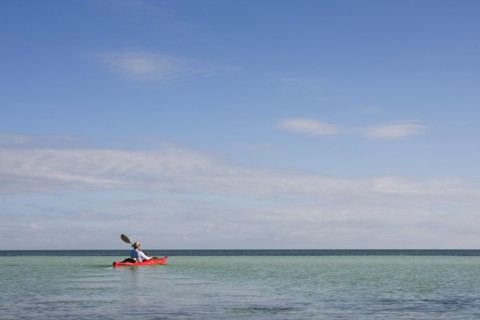 Man Kayaking on Ocean, Florida Keys, USA