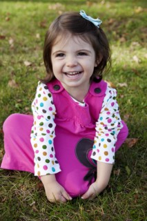 Young Girl in Pink Dress Laughing