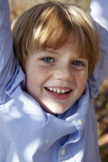Smiling Boy With Arms Up, Close-Up
