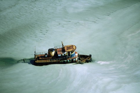 Tugboat in Icy Water, High Angle View