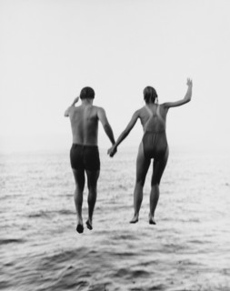 Couple Jumping into Water, Rear View
