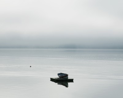 Rowboat Floating on a Dock