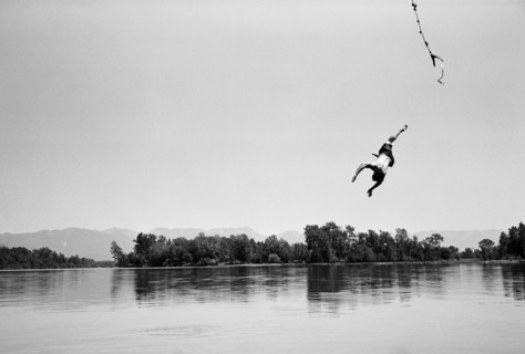 Man Falling from Swinging Rope into Lake