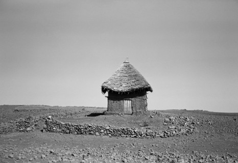 Adobe and Straw House in Field of Rocks