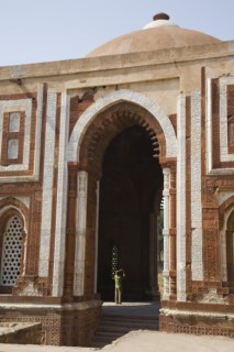 Man Taking Picture in Archway of Tall Mosque, New Delhi, India