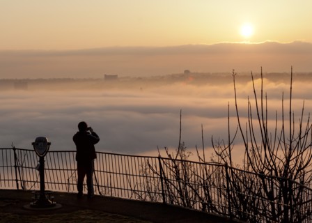 Person Photographing Fog Over River