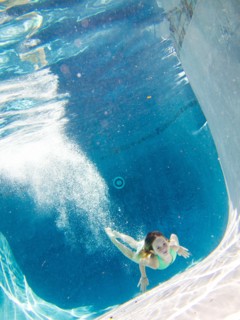 Girl Underwater in Pool After Diving
