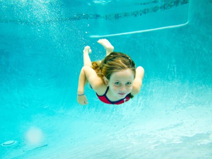 Girl Swimming Underwater in Pool, Eye Contact 3