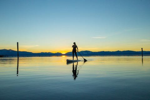 Woman on Paddle Board at Sunset, Lake Tahoe, Nevada, USA