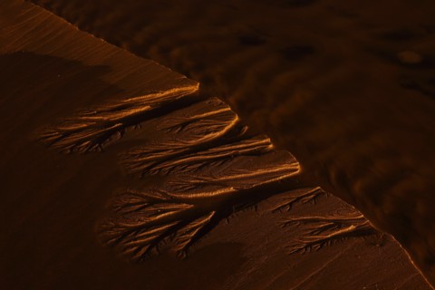 Water Making Pattern in Beach Sand