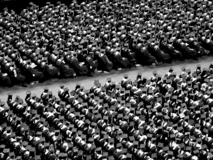 College Graduates Sitting at Graduation Ceremony