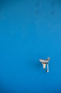 Water Fountain Against Blue Wall