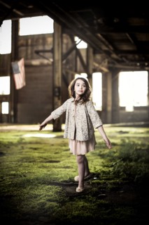 Young Girl Dancing in Abandoned Warehouse