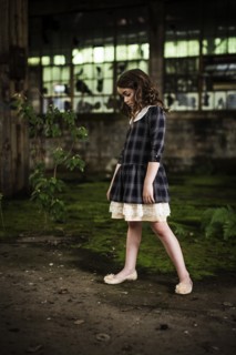 Young Girl Looking Down in Abandoned Warehouse, Portrait