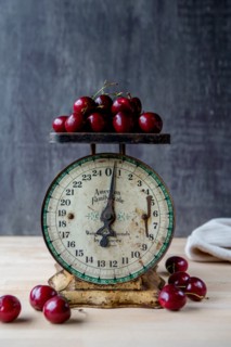 Cherries on Antique Scale