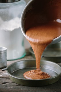 Cake Batter Being Poured into Cake Tin
