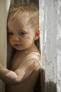 Melancholy Baby Between Curtains