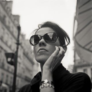 Woman Wearing Dark Sunglasses, Portait, Low Angle View, Paris, France