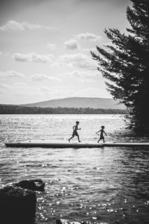 Two Boys Running on Dock