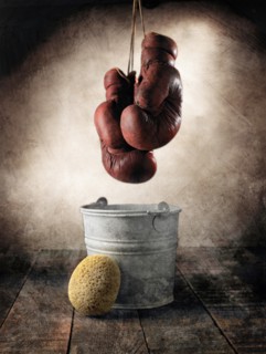 Boxing Gloves Hanging Over Bucket and Sponge