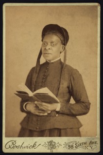 Three-quarter Length Portrait of African American Woman Posed with Book, by Harriet L. Bostwick, William A. Gladstone Collection of African American Photographs, 1880's