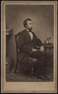 Full-Length Seated Portrait of Abraham Lincoln, his first sitting for a Portrait, Washington DC, USA, Photograph by Alexander Gardner, 1861