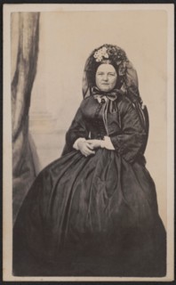 Full-Length Seated Portrait Mary Todd Lincoln in Mourning Attire after the death of her son, Willie in 1862, Photograph by Joseph Ward, possibly 1863, when she entered a period of half-mourning by evi...