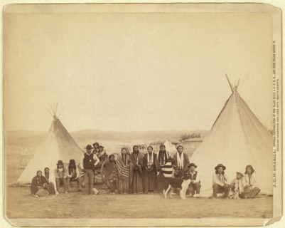 Group of Miniconjou Men, Women and Children, Group Portrait between two Tipis, Pine Ridge Reservation, South Dakota, USA, Photograph by John C.H. Grabill, 1890