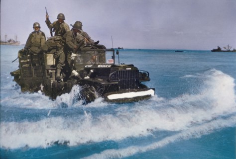 U.S. Military Truck with Soldiers driving through water toward shore during Invasion of Normandy, France, June 1944