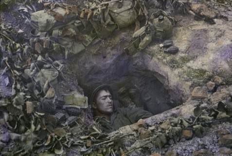 Two U.S. Infantrymen Share a Foxhole near Frontlines after the Allied Invasion of Normandy, Near Bayeux, Calvados, France, July 1944