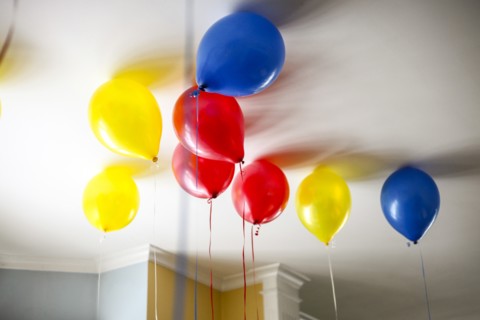 Colorful Helium-Filled Balloons on Ceiling,