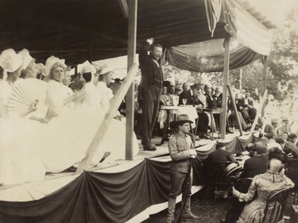 U.S. President Theodore Roosevelt Speaking to Crowd from Flag-Draped Platform during 250th Anniversary Celebration of the Town's Founding, Huntington, New York, USA, July 4, 1903