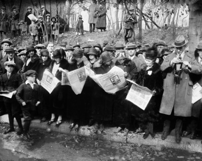 Group reading newspapers with News of Death of Former U.S. President Woodrow Wilson, Washington, D.C., USA, Harris & Ewing, February 1924