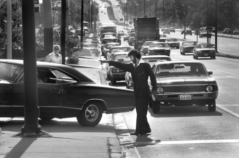 Man Directing Line of Cars at Gas Station during Oil Crisis, Maryland, USA, photograph by Thomas J. O'Halloran, June, 15 1979