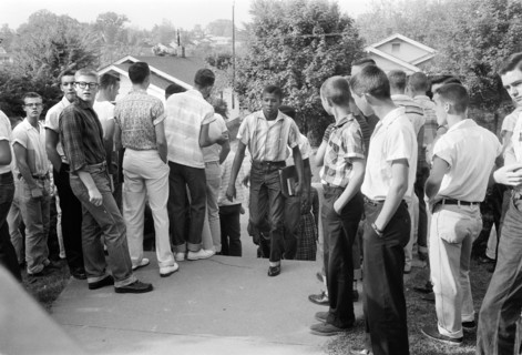 African American Boy Walking through Crowd of White Boys during Period of Violence Related to School Integration, Clinton, Tennessee, USA, photograph by Thomas J. O'Halloran, September 1956