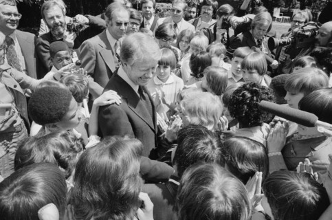 U.S. President Jimmy Carter surrounded by school children, North Carolina, USA, photograph by Thomas J. O'Halloran, April 29, 1977