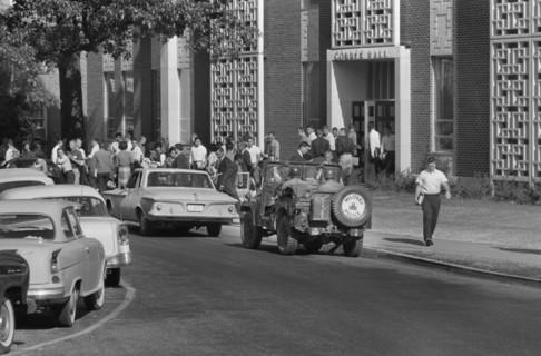 Students and Soldiers in Military Vehicle outside of buildings during Integration of University of Mississippi, Oxford, Mississippi, USA, photograph by Marion S. Trikosko, October 4, 1962