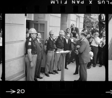 Governor George Wallace attempting to block Integration by standing defiantly at Door while being confronted by Deputy U.S. Attorney General Nicholas Katzenbach, University of Alabama, Tuscaloosa, Ala...