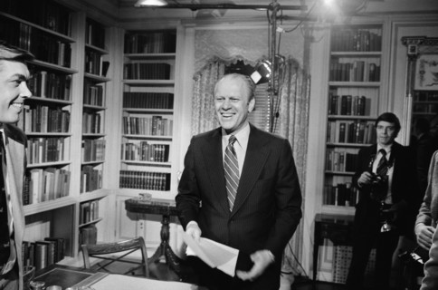 U.S. President Gerald Ford standing and smiling after giving a television speech at the White House, Washington, D.C., photograph by Marion S. Trikosko, January 13, 1975