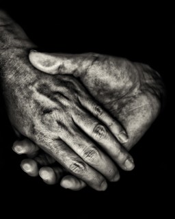 Two Hands on Black Background