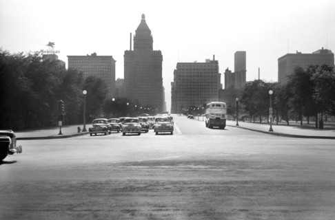 Cars stopped at Traffic Light on East Jackson Boulevard with Straus (left center