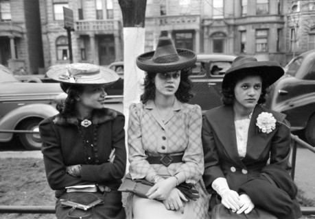 Three Young Adult Women waiting for Episcopal Church to end so they can see the Processional