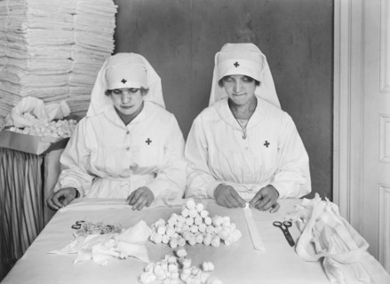 Two French Women employed by American Red Cross to mold Gauze Packing at American Red Cross Workrooms for Surgical Dressings
