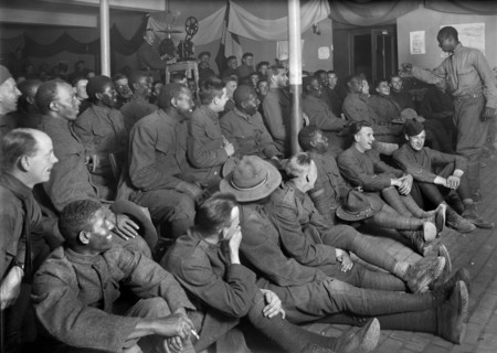 American Soldier entertaining Group of American Soldiers