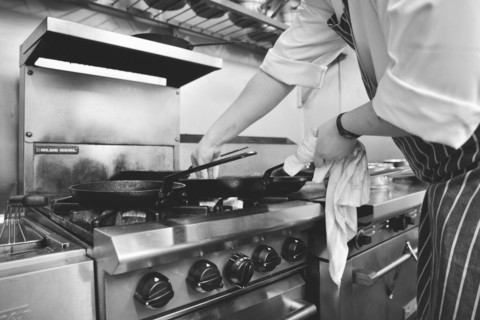 Chef Cooking on Restaurant Stove