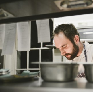 Head and Shoulders view of Chef in Restaurant Kitchen